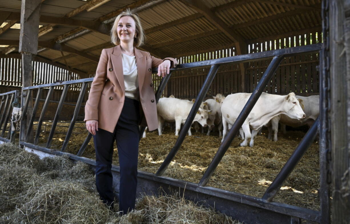 Liz Truss visits Twelve Oaks Farm in Newton Abbot, south west England, Monday Aug. 1, 2022. Rishi Sunak and Foreign Secretary Liz Truss are running to succeed Boris Johnson as party leader. The winner will be chosen by Conservative Party members across the country, and polls of party members give Truss the edge.