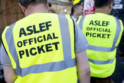 Aslef, Associated Society of Locomotive Engineers and Firemen members are pictured on a picket line at Willesden Junction station as members of the drivers union at nine train operators walk out for 24 hours over pay, in London, Saturday, Aug. 13, 2022.