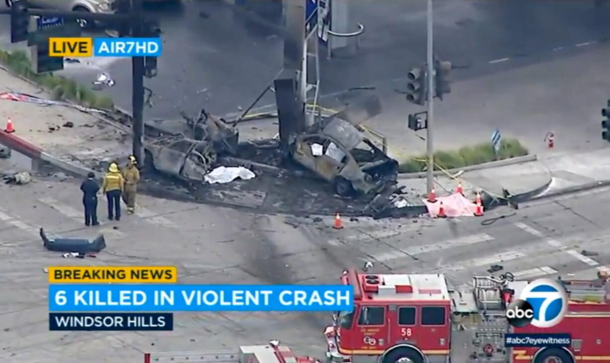 This aerial image taken from video provided by KABC-TV shows authorities responding to a traffic accident in the suburban neighborhood Windsor Hills, in Los Angeles, on Thursday, Aug. 4, 2022. Several people were killed, including an infant and a pregnant person, and others were injured in a fiery traffic collision in Southern California.