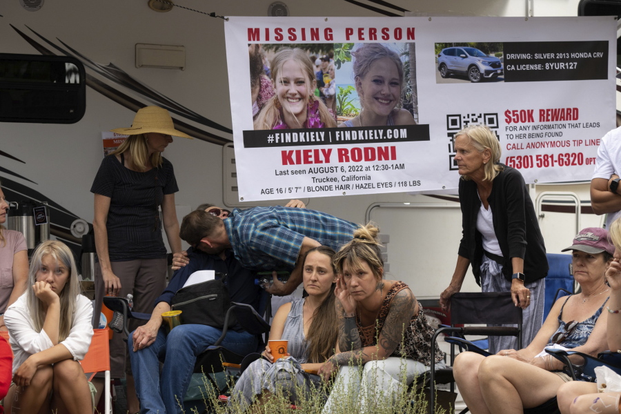 Lindsey Rodni-Nieman, center, mother of missing 16-year-old Kiely Rodni, listens to law enforcement during a news conference, Tuesday, August 9, 2022, in Truckee, Calif.