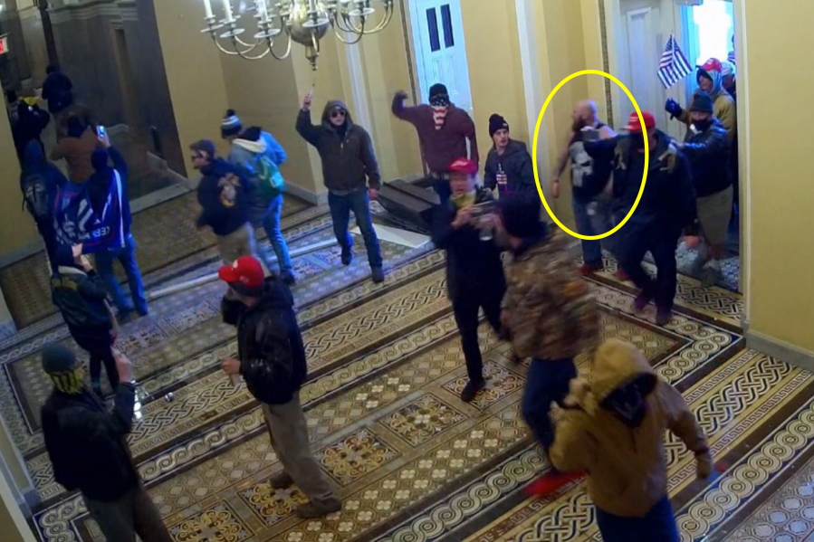 This image from U.S. Capitol Police security video and contained in the government's sentencing memorandum for Joshua Pruitt, circled in yellow by source, shows him entering the U.S. Capitol on Jan. 6, 2021, in Washington. Pruitt, a Maryland man affiliated with the far-right Proud Boys extremist group, has been sentenced to more than four years in prison for storming the U.S. Capitol.
