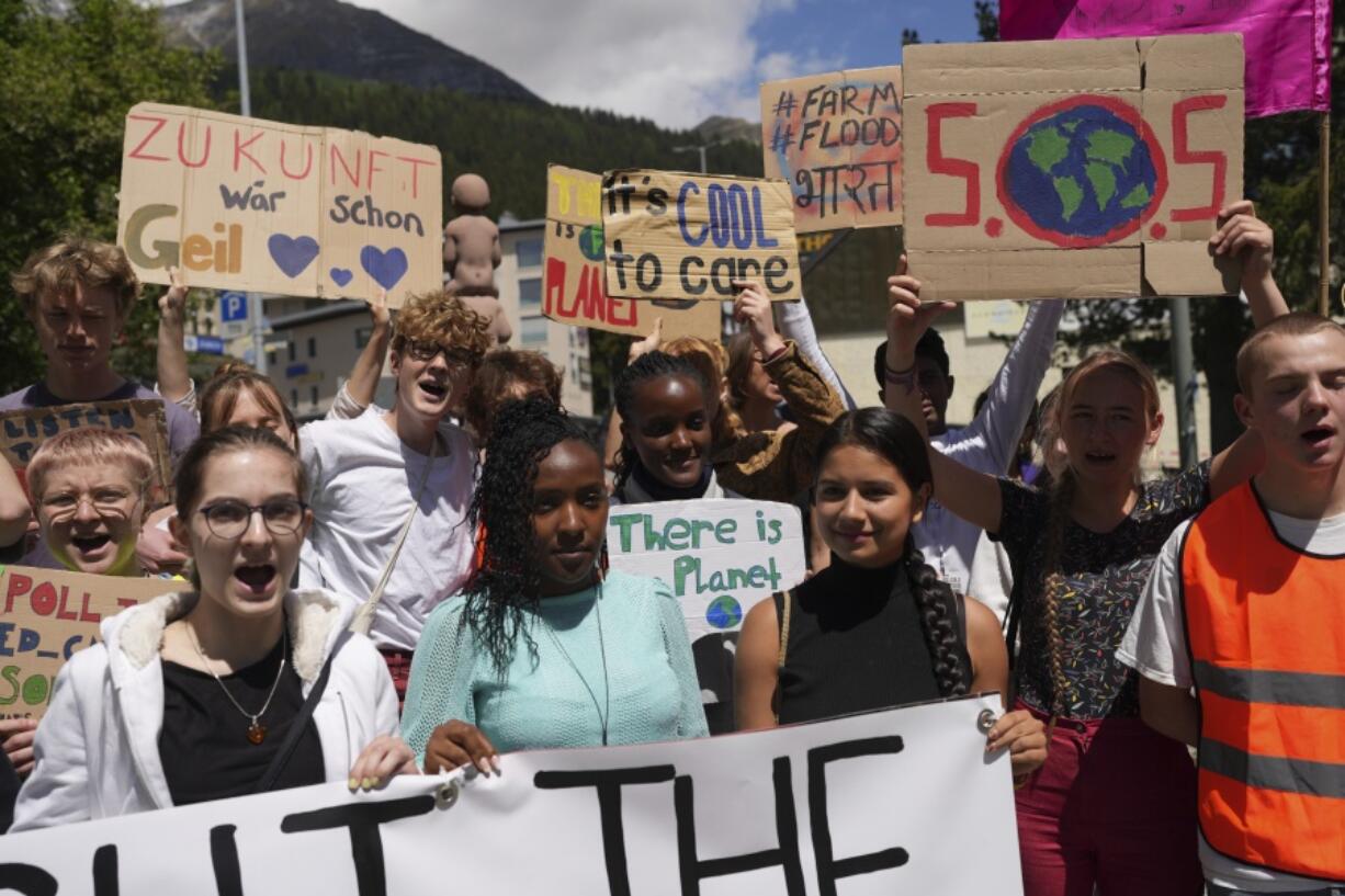 Climate activists attend the climate protest alongside the World Economic Forum in Davos, Switzerland, on May 26. A group of top climate scientists say the world needs to think about the ultimate climate catastrophe, human extinction, and how possible it is.