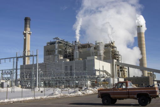 FILE - Carbon dioxide and other pollutants billows from stacks at the Naughton Power Plant, near where Bill Gates company, TerraPower plans to build an advanced, nontraditional nuclear reactor, on Jan. 12, 2022, in Kemmerer, Wyo. A major economic bill headed to the president has "game-changing" incentives for the nuclear energy industry, experts say, and those tax credits are even more substantial if a facility is sited in a community where a coal plant is closing.
