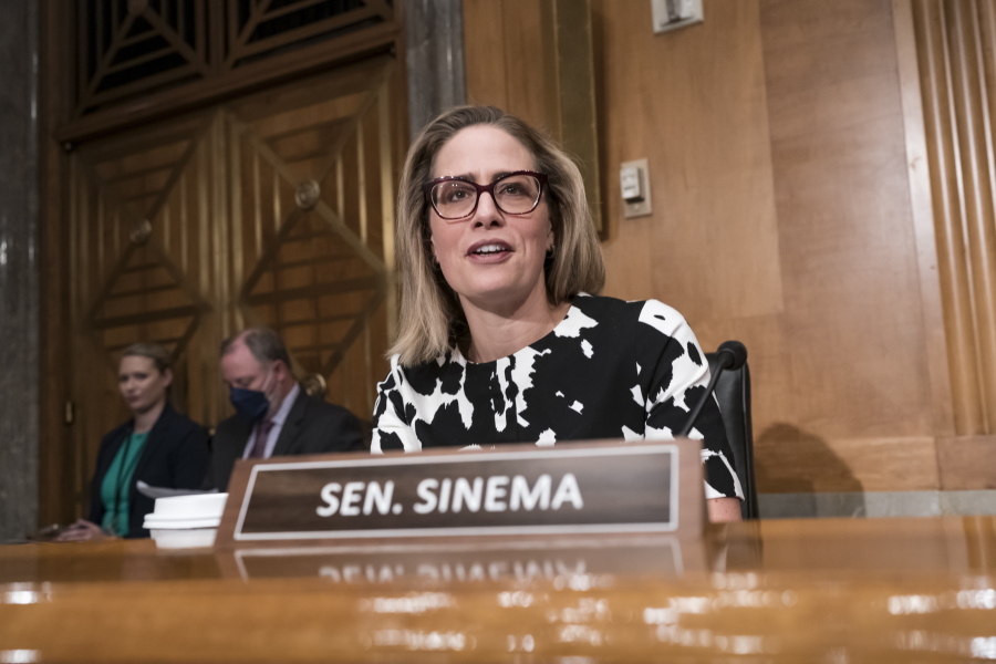 Sen. Kyrsten Sinema, D-Ariz., arrives for a meeting of the Senate Homeland Security Committee at the Capitol in Washington, Wednesday, Aug. 3, 2022. Sinema's views remained a mystery as party leaders eye votes later this week on their emerging economic legislation. (AP Photo/J.