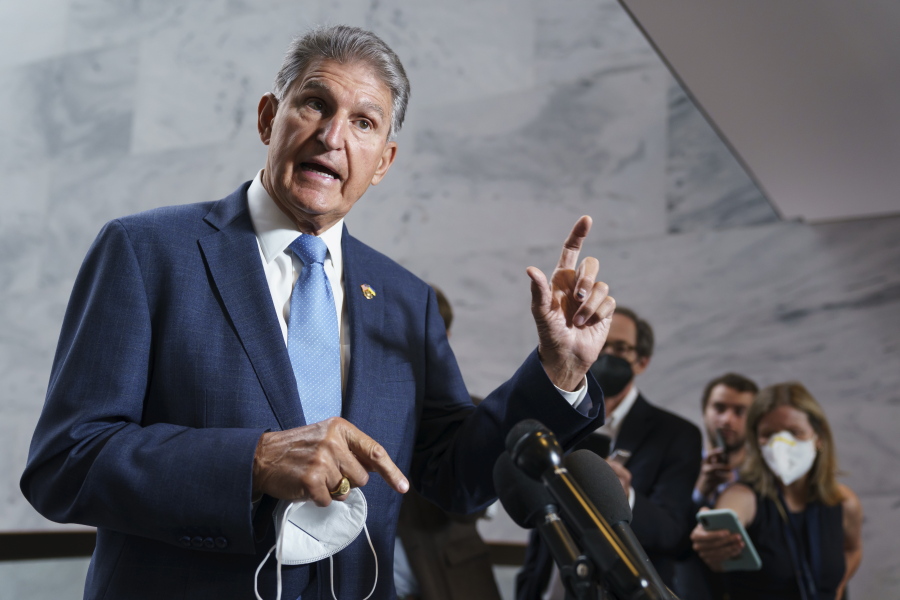 FILE - Sen. Joe Manchin, D-W.Va., talks with reporters as the Capitol in Washington, Aug. 1, 2022. Sen. Susan Collins, R-Maine, and Manchin are making the case for overhauling the 1800s-era Electoral Count Act. The two senators pushed Aug. 3, for quick passage of their bipartisan compromise that would make it harder for a losing candidate to overturn the legitimate results of a presidential election.(AP Photo/J.