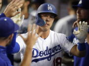 Los Angeles Dodgers' Jake Lamb (18) returns to the dugout after hitting a home run during the seventh inning of a baseball game against the Chicago Cubs in Los Angeles, Saturday, July 9, 2022.