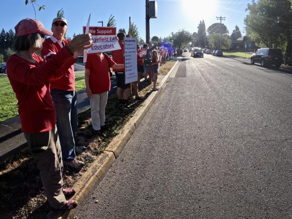 Teachers and supporters gather in front of the Ridgefield School District offices at a rally preceding union negotiations, Monday. The Union has promised a strike vote tonight if an agreement is not met.