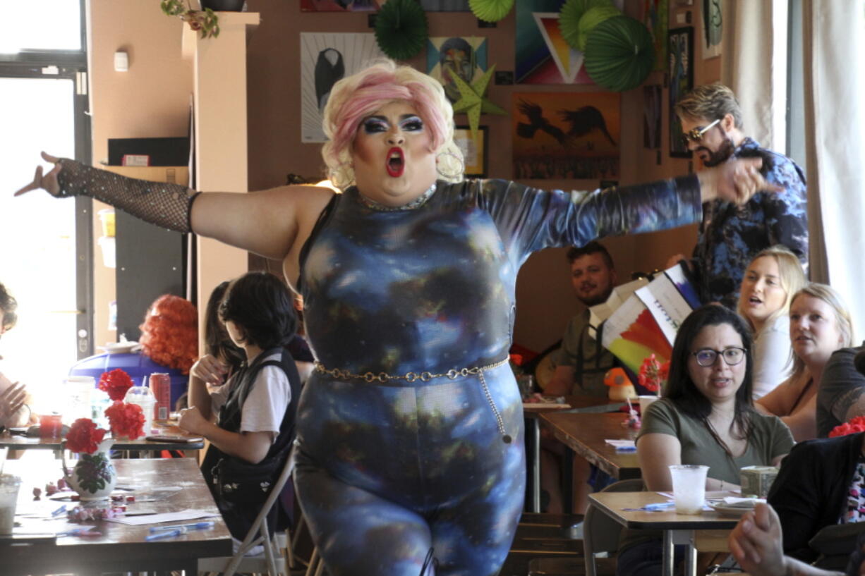 Drag queen Dela Rose performs July 28 at a mock election at Cafecito Bonito in Anchorage, Alaska, where people ranked the performances by drag performers. Several organizations are using different methods to teach Alaskans about ranked choice voting, which will be used in the upcoming special U.S. House election.