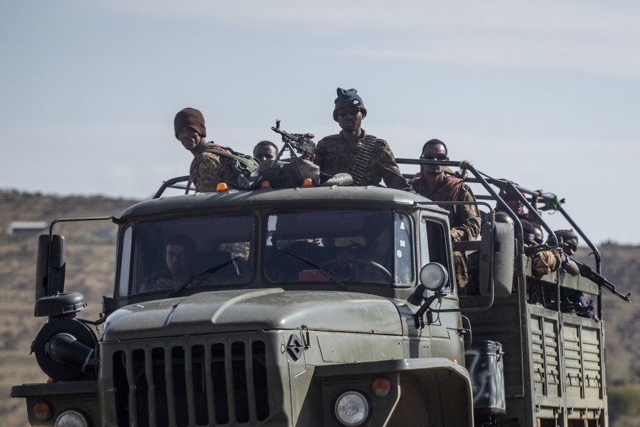 FILE - Ethiopian government soldiers ride in the back of a truck on a road near Agula, north of Mekele, in the Tigray region of northern Ethiopia on May 8, 2021. Authorities in Ethiopia's northern Tigray region alleged Wednesday, Aug. 24, 2022 that Ethiopia's military launched a "large-scale" offensive for the first time in a year, while Ethiopia's military spokesman did not immediately respond to questions.