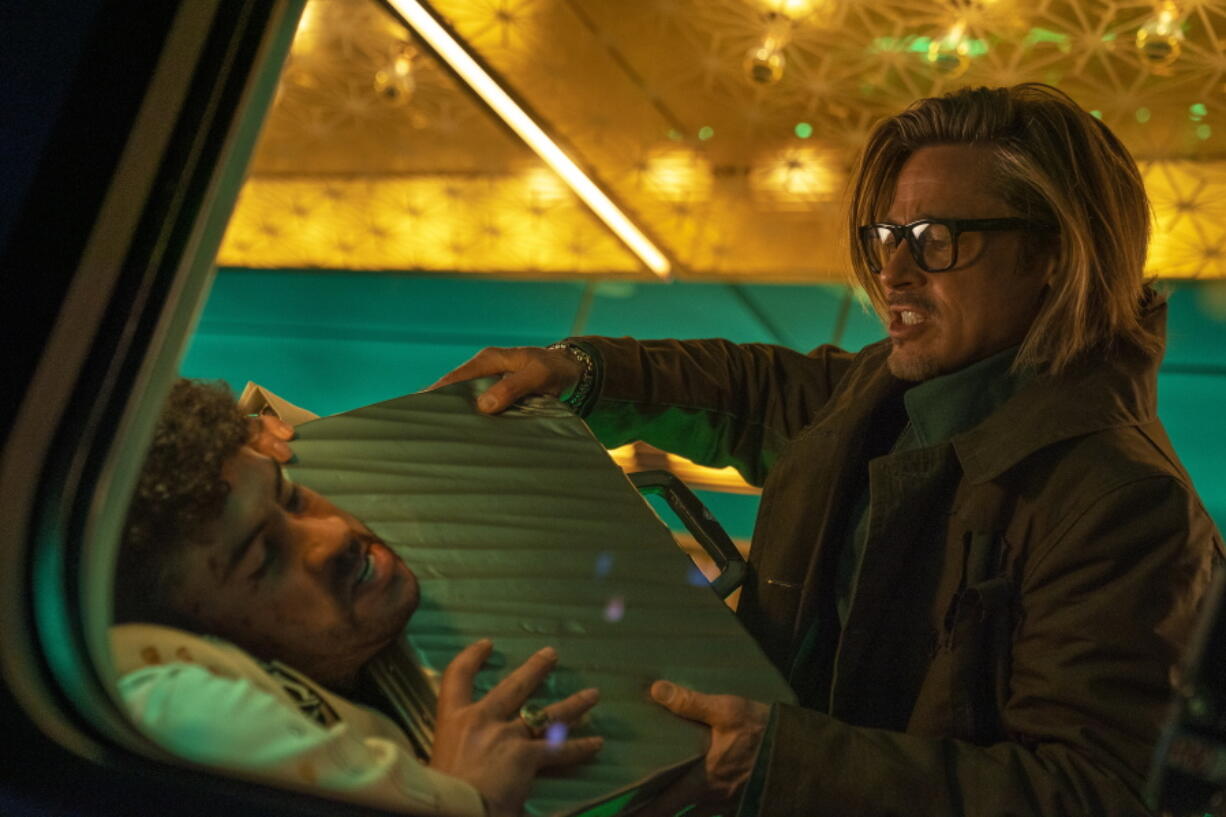 Bad Bunny, left, and Brad Pitt in a scene from "Bullet Train." Bad Bunny is the latest Latino artist to make the jump from concert stages to coveted movie roles with his performance as a knife-wielding assassin in the new action-comedy.