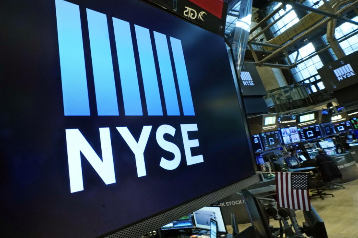 FILE - The New York Stock Exchange logo adorns a trading post on the floor of the Exchange on March 16, 2022, in New York. Stocks are rising again at the start of trading on Wall Street on Friday, Aug. 12, 2022, putting the S&P 500 on track for its first four-week winning streak since November.