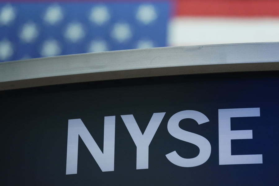 FILE- A sign for New York Stock Exchange is displayed on the floor at the NYSE in New York, Wednesday, July 27, 2022. Stocks were modestly higher early Friday, July 29, 2022, on Wall Street, despite news that closely watched inflation data jumped by the most in four decades last month.