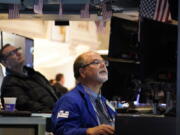 Traders work on the floor at the New York Stock Exchange in New York, Wednesday, Aug. 10, 2022.