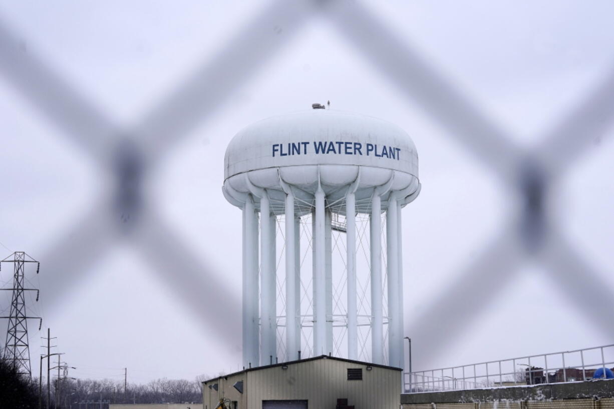 FILE - The Flint water plant tower is seen on Jan. 6, 2022, in Flint, Mich. A judge declared a mistrial Thursday, Aug. 11, after jurors said they couldn't reach a verdict in a dispute over whether two engineering firms should bear some responsibility for Flint's lead-contaminated water. Four families accused Veolia North America and Lockwood, Andrews & Newman, known as LAN, of not doing enough to get Flint to treat the highly corrosive water or to urge a return to a regional water supplier.