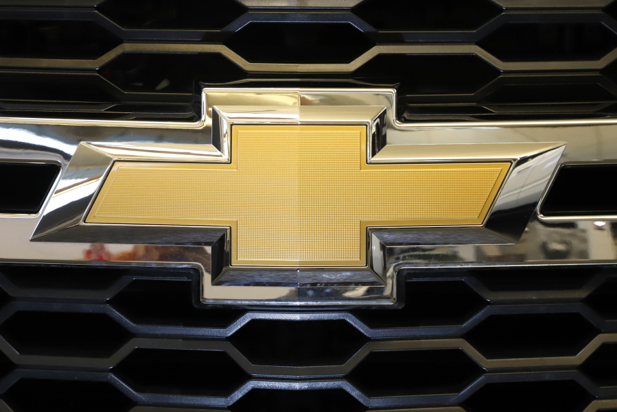 FILE - The Chevrolet logo is displayed at the 2020 Pittsburgh International Auto Show Thursday, Feb.13, 2020 in Pittsburgh.   General Motors is recalling more than 484,000 large SUVs in the U.S., Tuesday, Aug. 16, 2022, to fix a problem that can cause the third-row seat belts to malfunction. The recall covers Chevrolet Suburbans and Tahoes, Cadillac Escalades and GMC Yukons from 2021 and 2022. (AP Photo/Gene J.