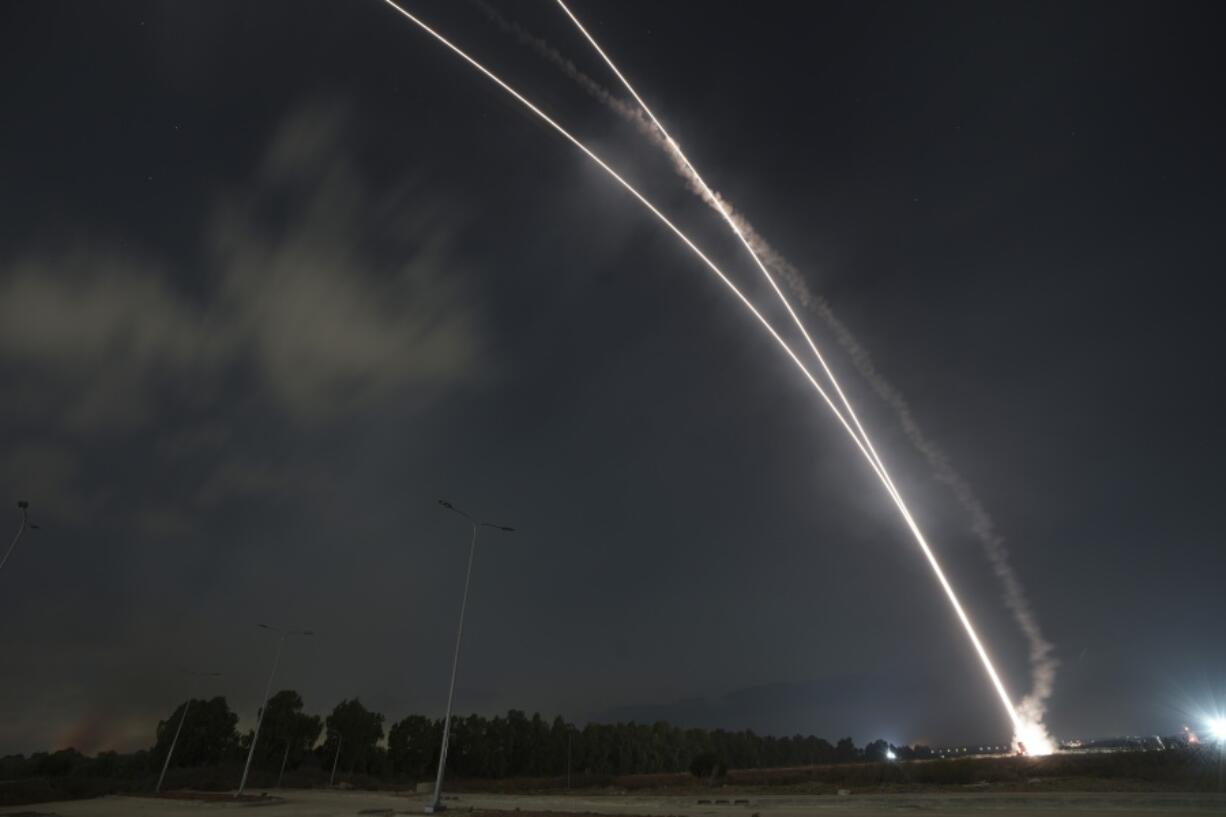 Israel's Iron Dome anti-missile system fires to intercept a rocket launched from the Gaza Strip towards Israel, near the Israeli Gaza border, Israel, Saturday, Aug. 6, 2022.