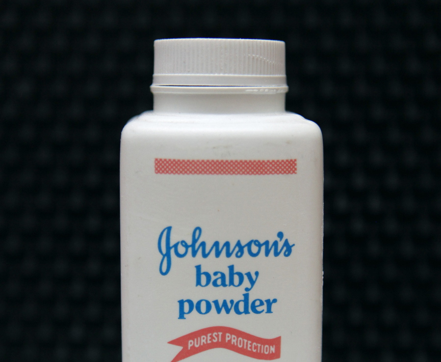 FILE - In this April 15, 2011 file photo, a bottle of Johnson's baby powder is displayed in San Francisco. Johnson & Johnson is pulling its iconic, talc-based Johnson's Baby Powder from shelves worldwide next year in favor of a product based on cornstarch. The health care giant's announcement Friday, Aug. 12, 2022, comes two years after it ended talc-based powder sales in the U.S.