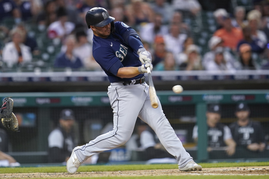 Seattle Mariners' Ty France hits a one-run single against the Detroit Tigers in the third inning of a baseball game in Detroit, Tuesday, Aug. 30, 2022.