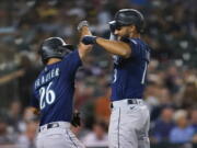 Seattle Mariners' Abraham Toro, right, celebrates his two-run home run with Adam Frazier (26) in the seventh inning of a baseball game against the Detroit Tigers in Detroit, Wednesday, Aug. 31, 2022.