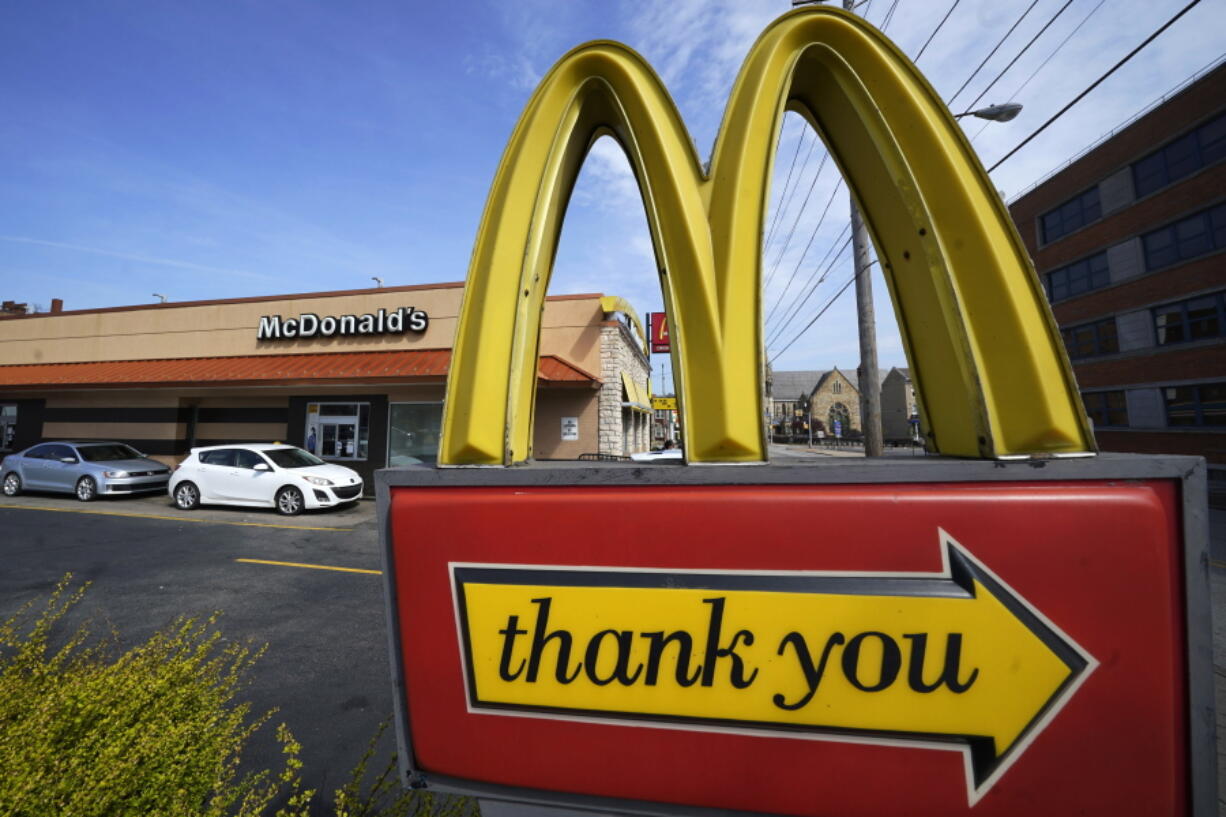 A sign is shown in front of an McDonald's restaurant in Pittsburgh on Saturday, April 23, 2022.  The Chicago-based company said, Tuesday, July 26,  it had net income of $1.60 per share. Earnings, adjusted for non-recurring costs, came to $2.55 per share. The results surpassed Wall Street expectations. (AP Photo/Gene J.