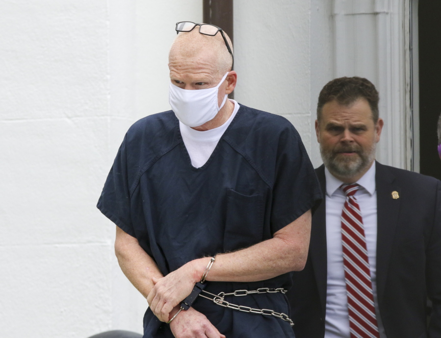 Alex Murdaugh is escorted out of the Colleton County Courthouse in Walterboro, S.C., on Wednesday, July 20, 2022. The once-powerful and now disbarred South Carolina attorney Alex Murdaugh pleaded not guilty on Wednesday to murdering his wife and son 13 months ago.
