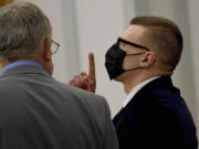 Volodymyr Zhukovskyy of West Springfield, Mass., gestures as the not guilty verdict is read while standing with his attorney, Steve Mirkin, at Coos County Superior Court in Lancaster, N.H., Tuesday, Aug. 9, 2022. The commercial truck driver was charged with negligent homicide in the deaths of seven motorcycle club members in a 2019 crash in Randolph, N.H.