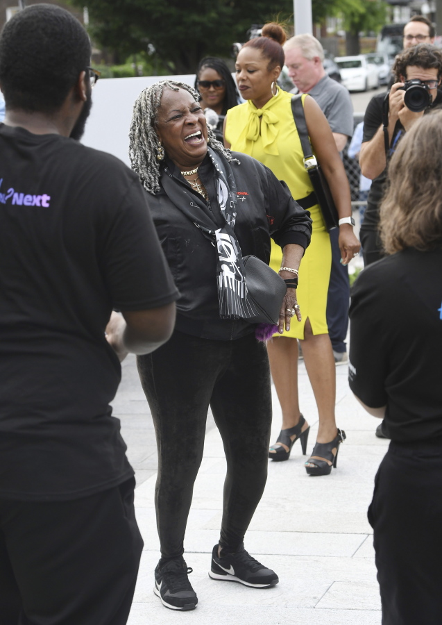 Martha Reeves of Martha and the Vandellas dances to Motown music playing at the Motown Museum. The museum celebrates the completion of two of three phases of an ambitious expansion plan, including a new courtyard in front of the museum, during a gathering in Detroit, Monday, August 8, 2022.