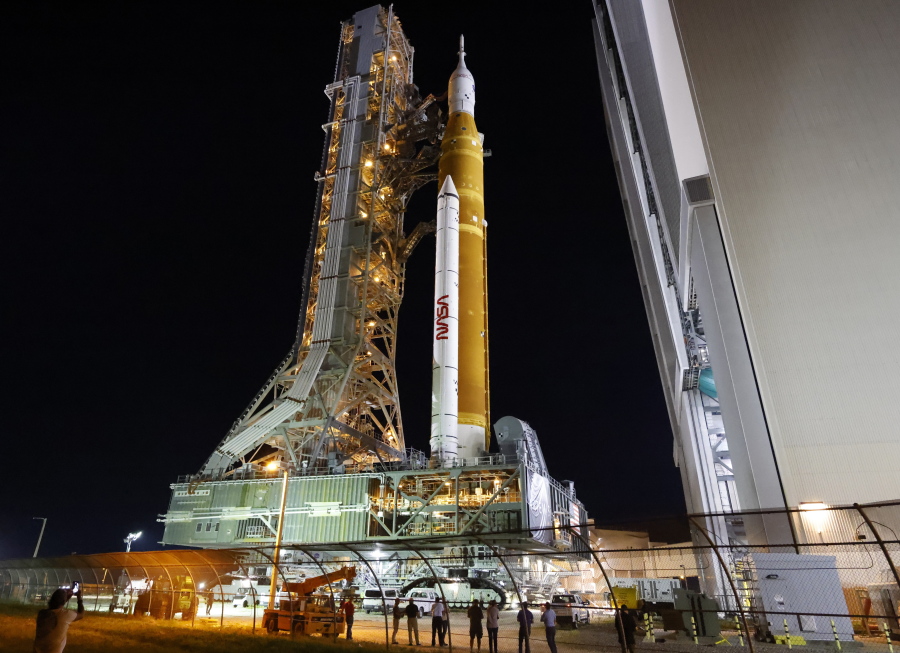 The NASA Artemis rocket with the Orion spacecraft aboard leaves the Vehicle Assembly Building moving slowly to pad 39B at the Kennedy Space Center in Cape Canaveral, Fla., Tuesday, Aug. 16, 2022. NASA is aiming for an Aug. 29 liftoff for the lunar test flight.