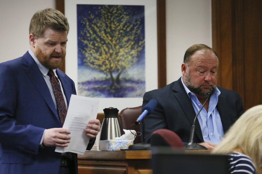 Mark Bankston, lawyer for Neil Heslin and Scarlett Lewis, asks Alex Jones questions about text messages during trial at the Travis County Courthouse in Austin, Wednesday Aug. 3, 2022.