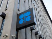 FILE - The logo of the Organization of the Petroleoum Exporting Countries (OPEC) is seen outside of OPEC's headquarters in Vienna, Austria, Thursday, March 3, 2022. The OPEC oil cartel and its allies are meeting on Wednesday, Aug. 3, 2022, to decide how much oil to produce in September. They're meeting amid high oil prices and unstable energy supplies exacerbated by the war Russia is waging on Ukraine.