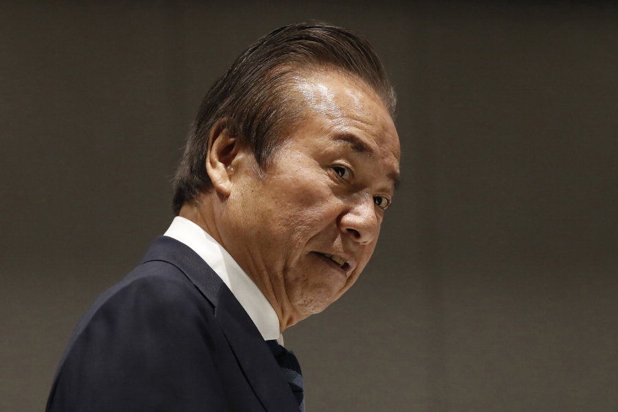 FILE - Haruyuki Takahashi, executive board member of the Tokyo Organizing Committee of the Olympic and Paralympic Games arrives at Tokyo 2020 Executive Board Meeting in Tokyo on March 30, 2020. Japanese prosecutors arrested Takahashi and three employees of a clothing company on bribery charges Wednesday, Aug. 17, 2022.