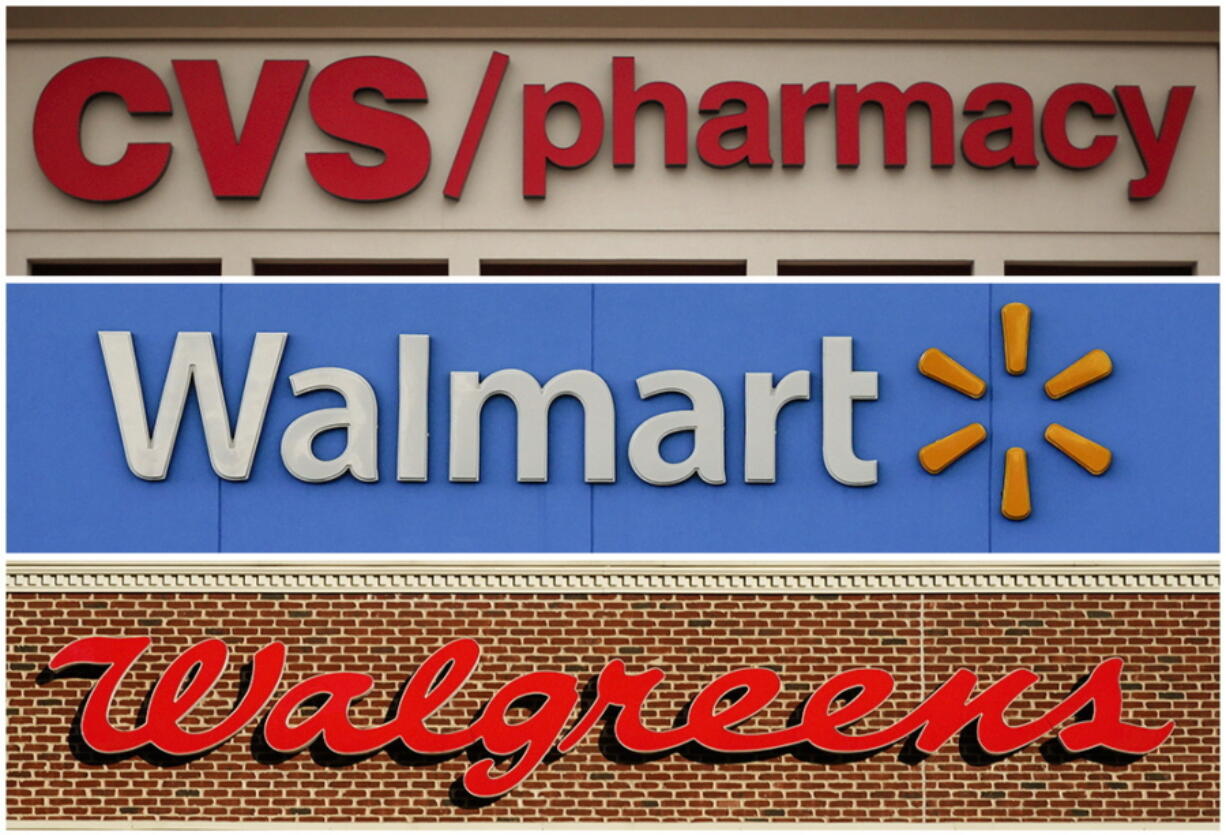 FILE - This undated combination of file photos show the signs of CVS, Walmart and Walgreens. A federal judge in Cleveland awarded $650 million in in damages on Wednesday, Aug. 17, 2022, to two Ohio counties that won a landmark lawsuit against national pharmacy chains CVS, Walgreens and Walmart, claiming the way they distributed opioids to customers caused severe harm to communities.
