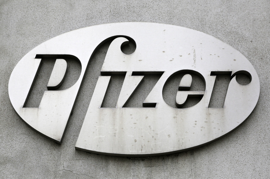 FILE - The Pfizer logo is displayed on the exterior of a former Pfizer factory, on May 4, 2014, in the Brooklyn borough of New York. Pfizer is buying sickle cell drug maker Global Blood Therapeutics in an approximately $5.4 billion deal as it looks to accelerate growth after its revenue soared during the pandemic. Both companies' boards have approved the deal, which still needs regulatory approval and approval from GBT shareholders.