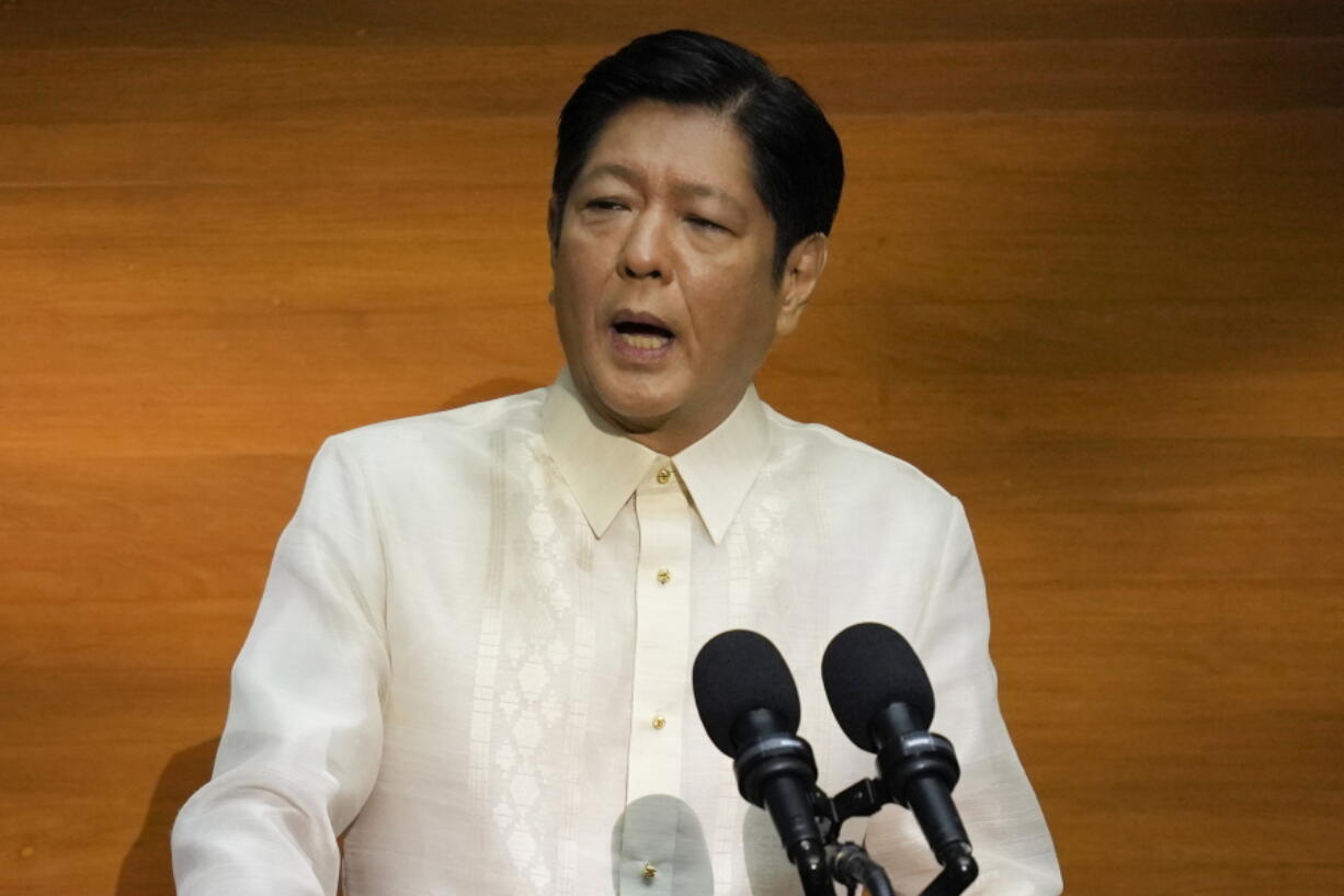 FILE - Philippine President Ferdinand Marcos Jr. delivers his first state of the nation address in, Quezon city, Philippines, July 25, 2022. Newly elected President Ferdinand Marcos Jr. said Monday Aug. 1, 2022 the Philippines has no plan to rejoin the International Criminal Court in a decision backing his predecessor's stance but rejects that of human rights activists.
