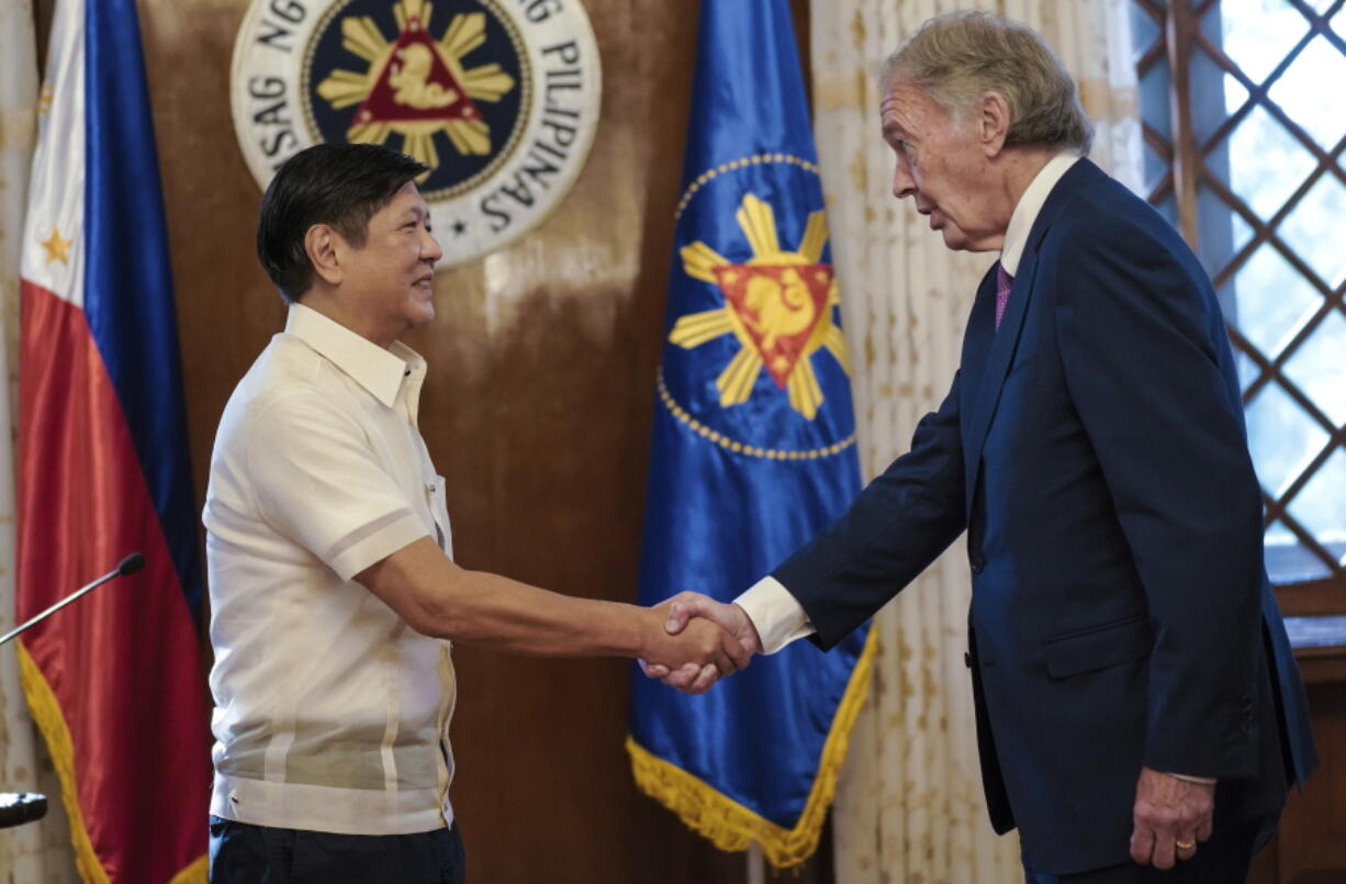 In this photo provided by the Malacanang Presidential Photographers Division, Philippine President Philippine President Ferdinand Marcos Jr., left, greets U.S. Sen. Edward Markey during the latter's courtesy call at the Malacanang presidential palace in Manila, Philippines on Thursday Aug. 18, 2022. Markey, who was once banned in the Philippines by former President Rodrigo Duterte, on Friday met a long-detained Filipino opposition leader, former senator Leila de Lima, whom he says has been wrongfully imprisoned under Duterte and should be freed.