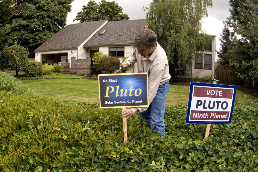 In 2006, software engineer Erik Kilk posted signs at his Vancouver home to protest Pluto's demotion from planet to dwarf planet.