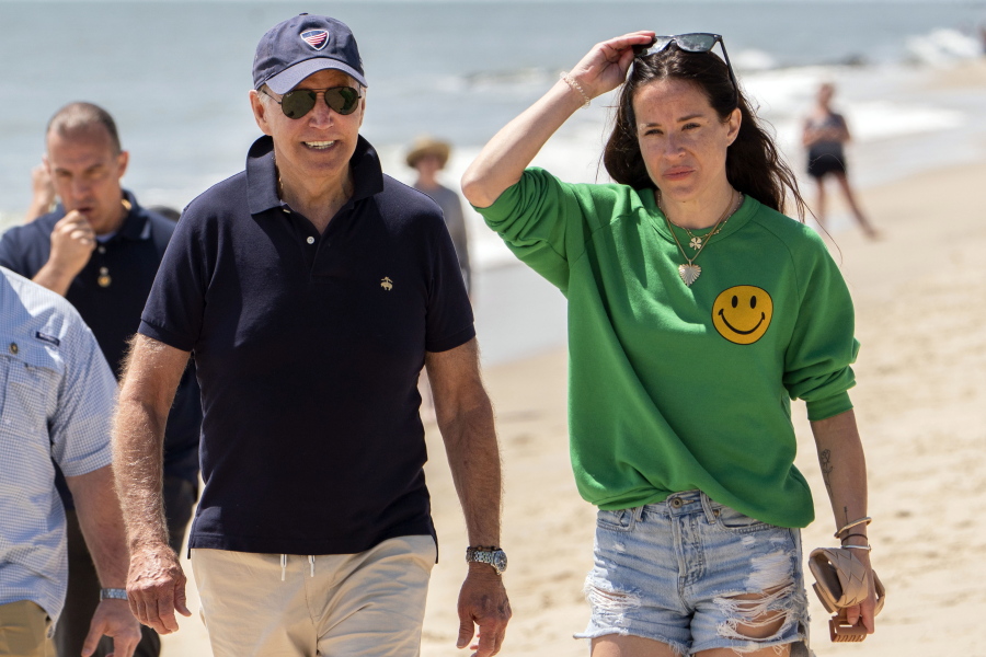 FILE -- President Joe Biden walks on the beach with daughter Ashley Biden, in Rehoboth Beach, Del., June 20, 2022. Two people have pleaded guilty in a scheme to peddle a diary and other items belonging to President Joe Biden's daughter Ashley to the conservative group Project Veritas, prosecutors said Thursday, Aug. 25, 2022.