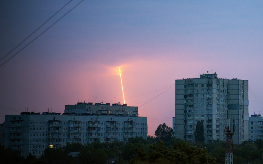 A Russian rocket launched toward Ukraine from Russia's Belgorod region is seen at dawn in Kharkiv, Ukraine, Thursday, Aug. 11, 2022.