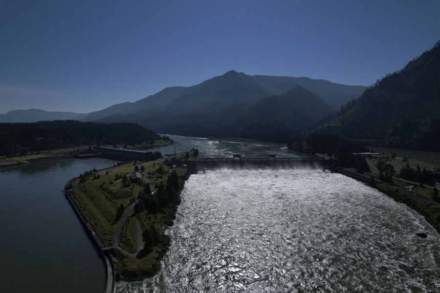Water spills over the Bonneville Dam on the Columbia River, which runs along the Washington and Oregon state line, on Tuesday, June 21, 2022. Hydroelectric dams, like the Bonneville Dam, on the Columbia and its tributaries have curtailed the river's flow, further imperiling salmon migration from the Pacific Ocean to their freshwater spawning grounds upstream.
