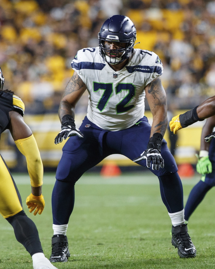 Seattle Seahawks offensive tackle Abraham Lucas (72) blocks during a preseason NFL football game against the Pittsburgh Steelers,  Saturday, Aug. 13, 2022, in Pittsburgh, Pa. Charles Cross and Abe Lucas were drafted to be the bookends to the Seattle Seahawks offensive now and in the future.
