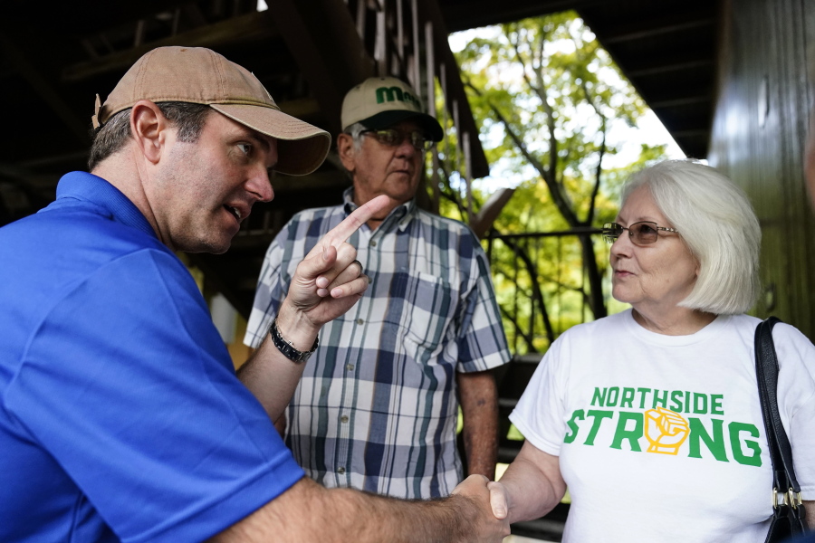 Kentucky Governor Andy Beshear, center, talks with residents that have been displaced by floodwaters at Jenny Wiley State Resort Park Saturday, Aug. 6, 2022, in Prestonsburg, Ky.