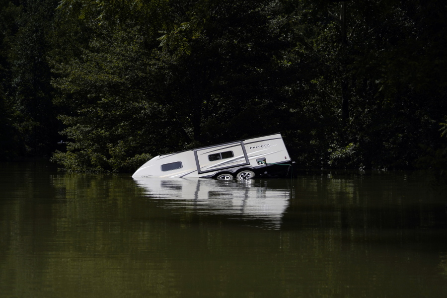 A camper is seen partly submerged under water in Carr Creek Lake on Wednesday, Aug. 3, 2022, near Hazard, Ky.