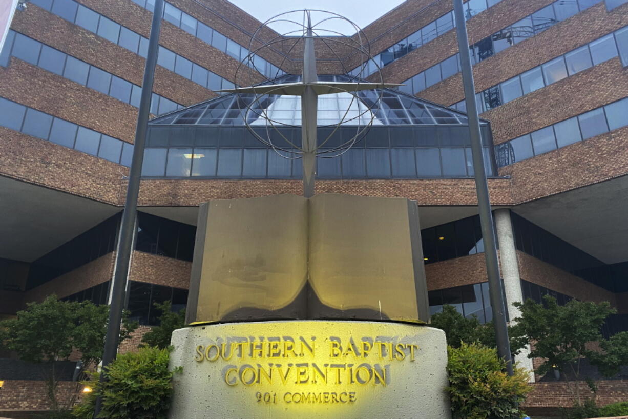 FILE - A cross and Bible sculpture stand outside the Southern Baptist Convention headquarters in Nashville, Tenn., on May 24, 2022. The Executive Committee of the Southern Baptist Convention said Friday, Aug. 12, 2022, that several of the denomination's major entities are under investigation by the U.S. Department of Justice.