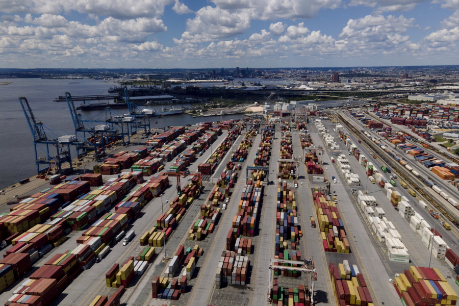 Shipping containers are stacked together at the Port of Baltimore, Friday, Aug. 12, 2022, in Baltimore. Six months into the war in Ukraine, American companies -- including federal contractors -- continue to buy everything from birch wood flooring to weapons-grade titanium from major Russian corporations.