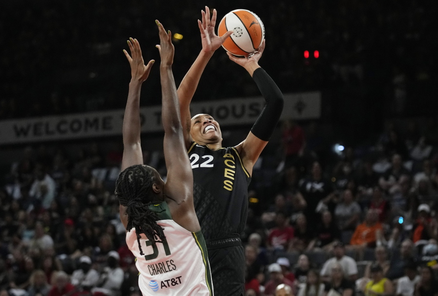 Las Vegas Aces forward A'ja Wilson (22) shoots over Seattle Storm's Tina Charles during the first half in Game 1 of a WNBA basketball semifinal playoff series Sunday, Aug. 28, 2022, in Las Vegas.