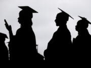 FILE - New graduates line up before the start of a community college commencement in East Rutherford, N.J., on May 17, 2018. President Joe Biden is expected to announce Wednesday Aug. 24, 2022 that many Americans can have up to $10,000 in federal student loan debt forgiven.