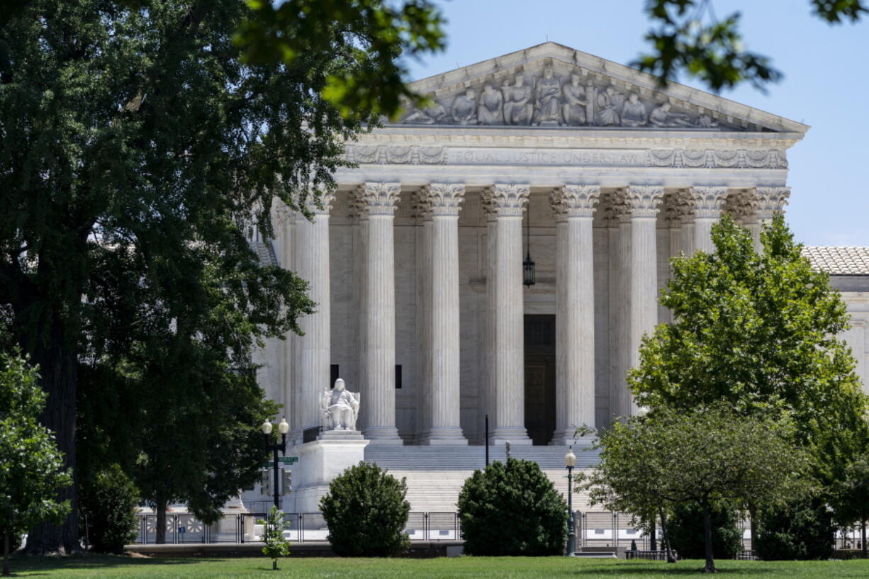 FILE - The Supreme Court is seen on Capitol Hill in Washington, July 14, 2022. The Supreme Court ruling expanding gun rights threatens to upend firearms restrictions across the country as activists wage court battles over everything from bans on AR-15-style guns to age limits. (AP Photo/J.