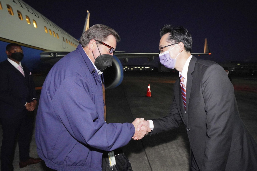 In this photo released by the Taiwan Ministry of Foreign Affairs, from left, U.S. Democratic House members John Garamendi shakes hands with Donald Yu-Tien Hsu, Director-General, dept. of North American Affairs, Taiwan's Ministry of Foreign Affairs after arriving on a U.S. government plane at Songshan airport in Taipei, Taiwan on Sunday, Aug 14, 2022. The delegation of American lawmakers are visiting Taiwan just 12 days after a visit by U.S. House Speaker Nancy Pelosi that angered China.