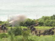 Taiwan's military conducts artillery live-fire drills at Fangshan township in Pingtung, southern Taiwan, Tuesday, Aug. 9, 2022. Taiwan's official Central News Agency reported that Taiwan's army will conduct live-fire artillery drills in southern Pingtung county on Tuesday and Thursday, in response to the Chinese exercises.