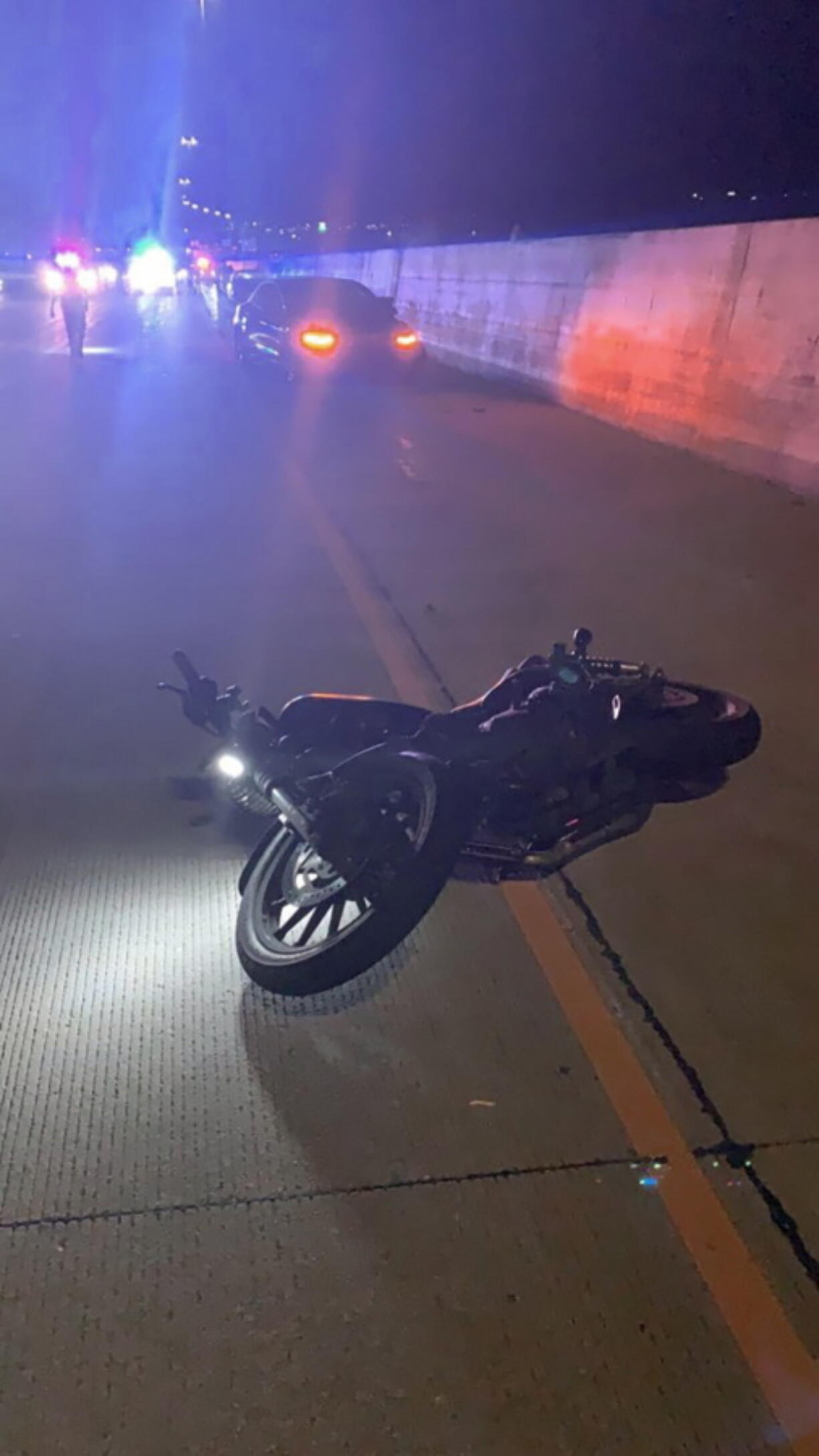 This photo provided by Utah Department of Public Safety shows the scene of an accident involving a Tesla and a motorcycle on July 24, 2022 near Draper, Utah. Two crashes involving Teslas apparently running on Autopilot are drawing scrutiny from federal regulators and point to a potential new hazard on U.S. freeways: The partially automated vehicles may not stop for motorcycles.